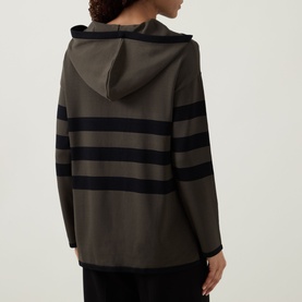 Model wearing Joseph Ribkoff Striped Hoodie in avocado and black, showing back view with bold stripes, hood, and asymmetric hemline.