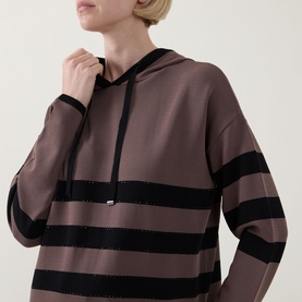 Model wearing Joseph Ribkoff mink and black striped hoodie top with drawstring hood and long sleeves, close-up detail view.