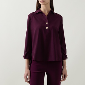 Model wearing Joseph Ribkoff Elderberry top with V-neck collar, three-quarter tie sleeves and two-button placket, styled with matching trousers.