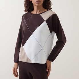 Model wearing Joseph Ribkoff Argyle Knitted Sweater in Mocha/Multi with crew neck and long sleeves, styled with matching dark trousers