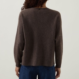 Model wearing Joseph Ribkoff Jewel Embellished Sweater in Dark Taupe Melange, back view, with jewel details on cashmere knit, styled with blue jeans.