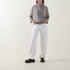 Model wearing Joseph Ribkoff Taupe Melange half-zip top with white straight-leg trousers and black chunky loafers.
