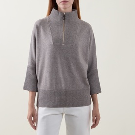 Model wearing Joseph Ribkoff Top in Taupe Melange, half-zip funnel neck, 3/4 sleeves, styled with white trousers
