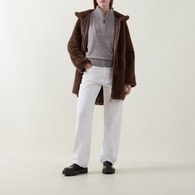 Model wearing Joseph Ribkoff Taupe Melange top, styled with brown shearling coat, white wide-leg trousers and black chunky loafers