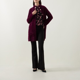 Model wearing Joseph Ribkoff Velour Flared-Leg Trousers in black, styled with a burgundy longline cardigan and floral blouse.