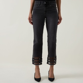 Model wearing Joseph Ribkoff Rhinestone Hem Jeans in Charcoal Grey, cropped skinny fit with lattice rhinestone trim at hem, styled with black heels.