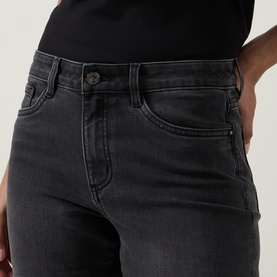 Model wearing Joseph Ribkoff Rhinestone Hem Jeans in charcoal grey, mid-rise skinny fit with five-pocket styling, paired with black top