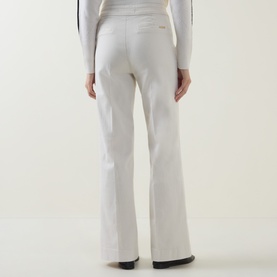 Model wearing Joseph Ribkoff High-Rise Wide Leg Jeans in Birch, shown from behind with pressed creases and wide leg silhouette, styled with a white