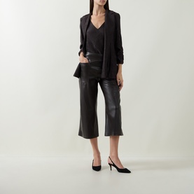 Model wearing Joseph Ribkoff Faux Leather Culottes Trousers in Mocha, wide-leg pull-on style with patch pockets, styled with black blazer and heels