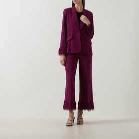 Model wearing Joseph Ribkoff Feather-Trim Cropped Trousers in Berry Burst with matching feather-cuff blazer and strappy heels.
