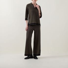 Model wearing Joseph Ribkoff Trousers in Avocado/Black with wide-leg silhouette and contrast trim, styled with matching top and black loafers.