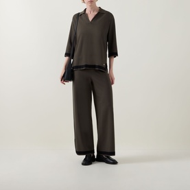 Model wearing Joseph Ribkoff Trousers in Avocado/Black with contrast black trim, styled with matching top and black loafers.