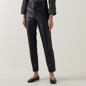 Model wearing Joseph Ribkoff black faux leather slim-leg trousers with elasticated waist, styled with black flat loafers