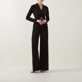 Model wearing Joseph Ribkoff Bronze wide-leg trousers in metallic fabric, styled with a matching belted top and heeled sandals.