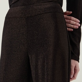 Model wearing Joseph Ribkoff bronze metallic wide-leg trousers with shimmer finish, styled with a dark long-sleeve top.