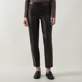 Model wearing Joseph Ribkoff Bonded Faux Leather Trousers in Mocha, straight-cut with elasticated waist and notched cuffs, styled with loafers