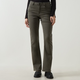 Model wearing Joseph Ribkoff Slim-Leg Jeans in Avocado, mid-rise straight-leg cut with five-pocket styling, styled with black top and chunky shoes