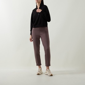 Model wearing Joseph Ribkoff Drawstring Track Pants in Mink, straight-cut with rolled cuffs and drawstring waist, styled with black half-zip top and