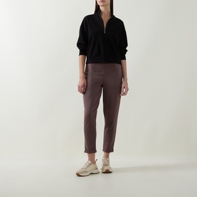 Model wearing Joseph Ribkoff Drawstring Track Pants in Mink, straight-cut with rolled cuffs and elasticated waistband, styled with black zip-neck top