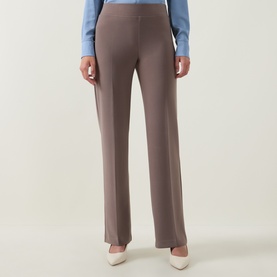 Model wearing Joseph Ribkoff Pleated Straight Leg Trousers in Mink with elasticated waist and straight leg; styled with blue shirt and cream heels