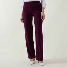Model wearing Joseph Ribkoff elderberry wide-leg trousers, styled with a white shirt and cream heels.
