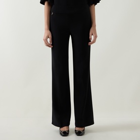 Model wearing Joseph Ribkoff black wide-leg trousers in polyester-spandex blend, styled with black heels and a ruffled top.