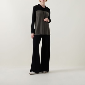 Model wearing Joseph Ribkoff Tunic in Avocado/Black colourblock, long sleeves, with wide-leg black trousers.