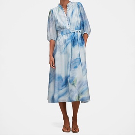 Model wearing Forever New Bluewater Abstract midi dress with puff sleeves, button neckline, and tie waist, styled with tan sandals.