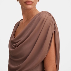 Model wearing Forever New dress in Portobello, featuring draped cowl neckline and gathered shoulder detail.