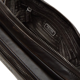 Prada Bandoliera Logo Messenger Bag in brown nappa leather, open interior view showing zip compartment and branded logo lining.