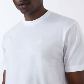 Model wearing Prada white cotton T-shirt with tonal embroidered logo at chest, crew neckline and short sleeves