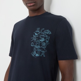 Model wearing Scotch & Soda Sky Captain navy cotton T-shirt with tonal blue graphic lettering print to chest