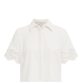 White cropped short-sleeve shirt with lace-trimmed scalloped sleeves and button-front fastening