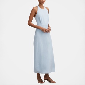 Model wearing Forever New Bluebell maxi dress with halterneck, sleeveless cut and A-line skirt, styled with brown heeled sandals