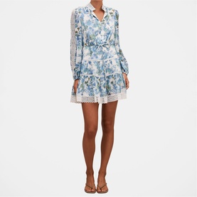 Model wearing Forever New Dangar Floral mini dress with long sleeves, lace trim hem and collar, styled with tan sandals