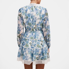 Model wearing Forever New Dangar Floral mini dress, blue floral print with lace trim detail, long sleeves, shown from back