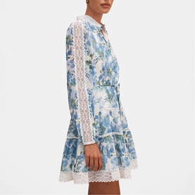 Model wearing Forever New Dangar Floral mini dress with lace trim detailing on sleeves, hem and front placket