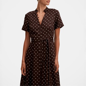 Model wearing brown polka dot wrap midi dress with short sleeves, V-neckline, and self-tie belt