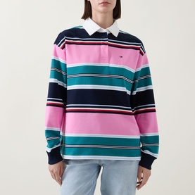 Model wearing Tommy Flag Logo Striped Rugby Top in Pink Daisy multi stripe with white collar, long sleeves and rib-knit cuffs, styled with light blue