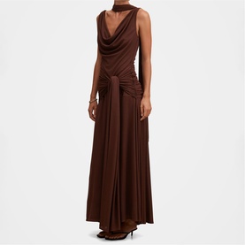 Model wearing Forever New Dark Mahogany maxi dress with cowl neckline, ruched bodice, knotted waist detail and flared skirt