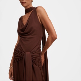 Model wearing Forever New Dark Mahogany draped halterneck dress with ruched tie waist detail, styled with a choker necklace.