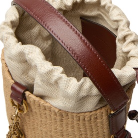 Chloe crossbody bucket bag in Crafty Brown, woven rattan body with cream canvas drawstring lining, burgundy leather trim and gold hardware