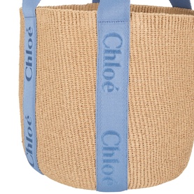 Chloe Ashes Blue woven straw tote bag with blue logo ribbon straps, close-up detail shot