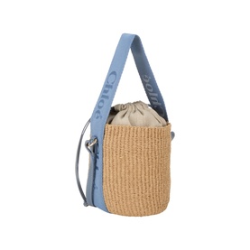 Chloe Ashes Blue woven paper bucket crossbody bag with blue leather top handle, silver hardware and drawstring top closure