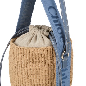 Chlo&eacute; Ashes Blue woven paper bucket crossbody bag with blue branded canvas strap and drawstring linen inner pouch, silver hardware