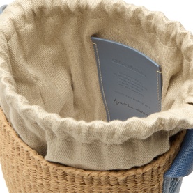 Chlo&eacute; Ashes Blue crossbody bag interior detail, woven paper exterior with linen drawstring lining and blue leather inner pocket