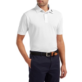 Model wearing white short-sleeve polo shirt with collar and button placket, styled with navy trousers and brown leather belt