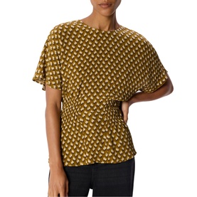 Model wearing Whistles green geometric print flutter sleeve top with ruched waist detail, styled with dark trousers.