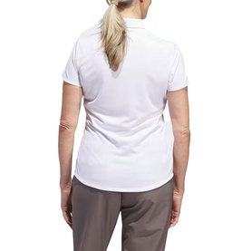 Model wearing Adidas Golf white short sleeve polo shirt, back view, styled with grey trousers
