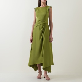 Model wearing Maisonel Beaded Drape Dress in Meadow, featuring cap sleeves, gathered waist, draped detail and asymmetric hemline, styled with strappy